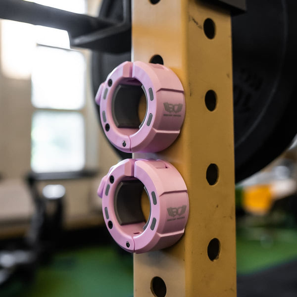 Pink Magnetic Barbell Collars/Barbell Clips with magnet in gym setting - Warm Body Cold Mind