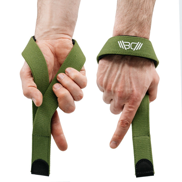 Straps V2 Pro Khaki with a brand logo being worn on hands against a white background - Warm Body Cold Mind