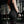 Person with tattoos wearing black WOMENS WEIGHTLIFTING COMPRESSION SINGLET S-3 with visible branding in an indoor setting (Back view) - Warm Body Cold Mind