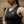 Woman in WOMEN'S WEIGHTLIFTING COMPRESSION SINGLET S-4 standing in a gym (close-up view) - Warm Body Cold Mind