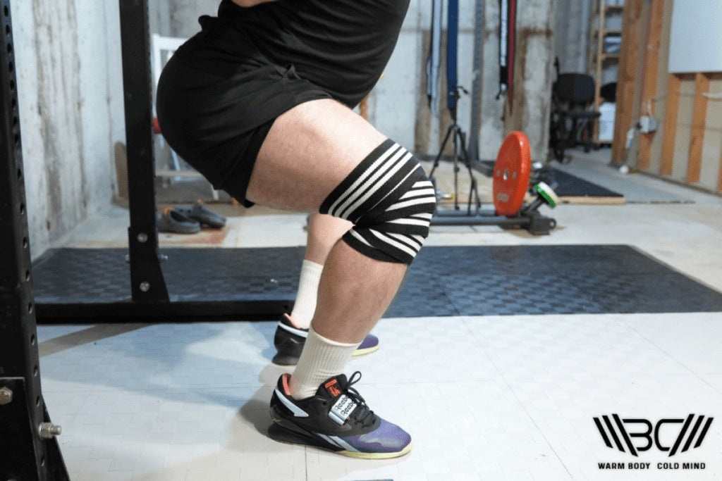 Squatting in knee wraps for squats